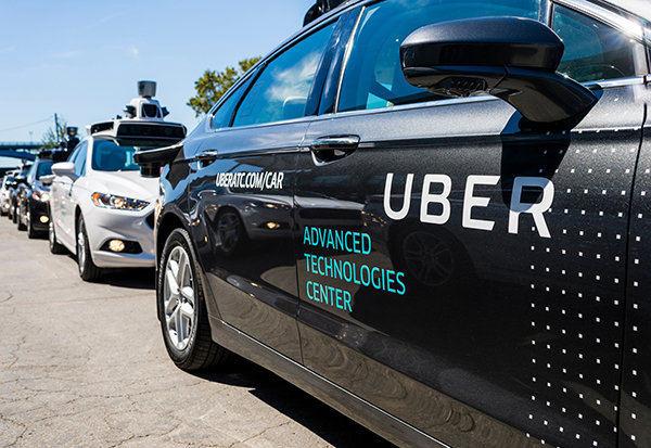 Uber's self-driving car kills Arizona woman crossing the street; Uber halts autonomous-car testing