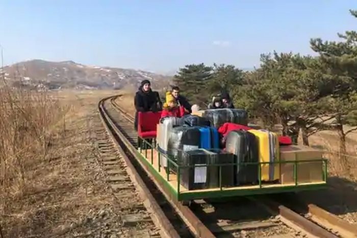 Russian diplomats leave North Korea using old hand-pushed trolley