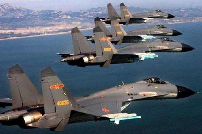 Taiwan says 25 Chinese Air Force warplanes breached its airspace and defense zone just a day after the U.S. warned China 