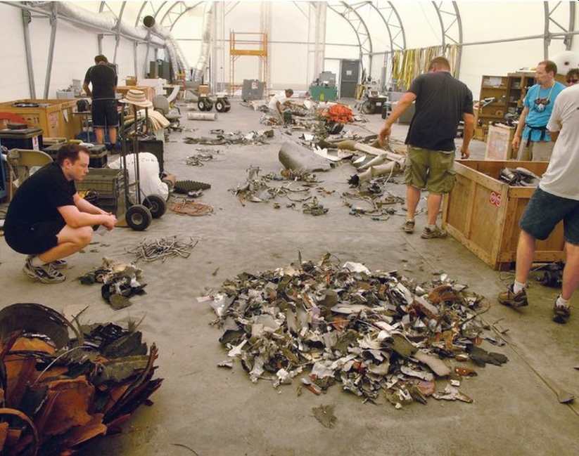 The first photo is of Elon Musk staring at debris from Falcon 1, which was the first of three failed rocket launches from SpaceX’s early days.